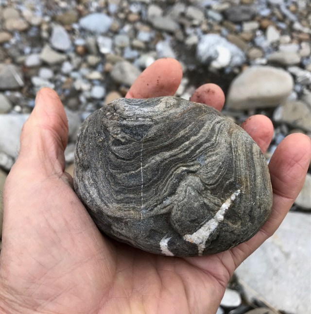 hold a pebble in your hand